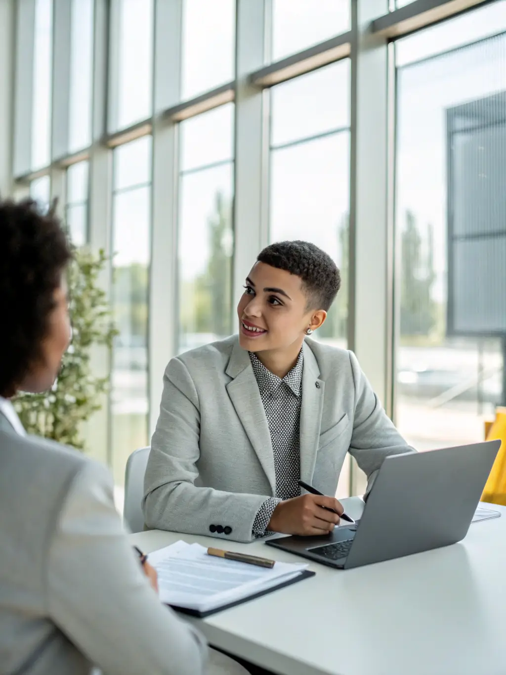 A person successfully negotiating a deal in a bright, modern office, symbolizing career advancement and strategic decision-making.